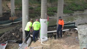 Is one of the LJ collars being installed. The collars are placed around the prepared concrete column and then wired to the steel in the column to provide a continual circuit around the column providing a galvanic current protection for the structure.